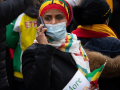 Protester-in-the-colors-of-Ethiopia-at-a-NoMore-PasPlus-in-French-demonstration-in-Paris-JA-1-Place-by-Jason-Cheng-FR-original