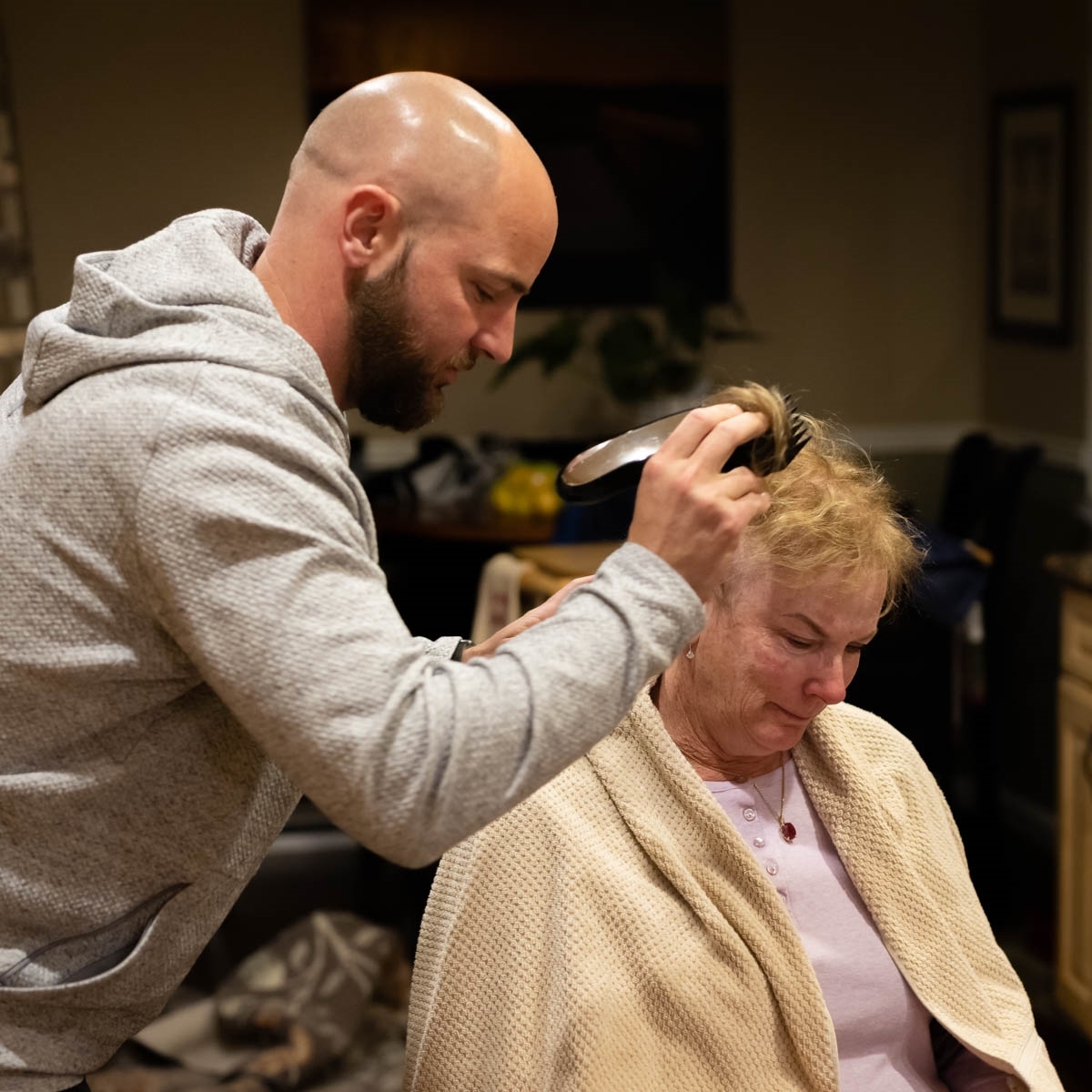 Haircut-2-As-the-haircut-begins-reality-sets-in-and-the-fear-and-emotions-of-this-moment-in-her-life-begin-to-show.-JM-Place-by-Michael-Funk-SR